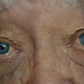 Close-up of an elderly person's blue eyes.